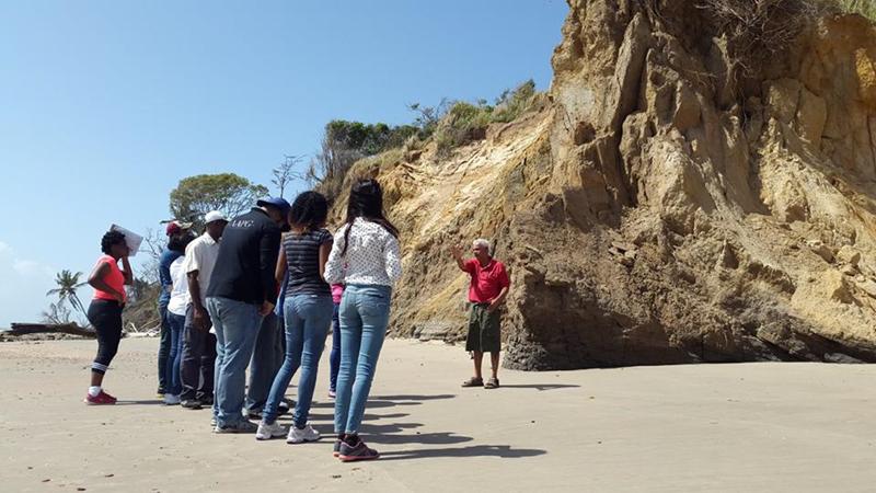 Dr. Persad explains the geology of the Southern Anticline and the folding of the rocks at Galfa Point.